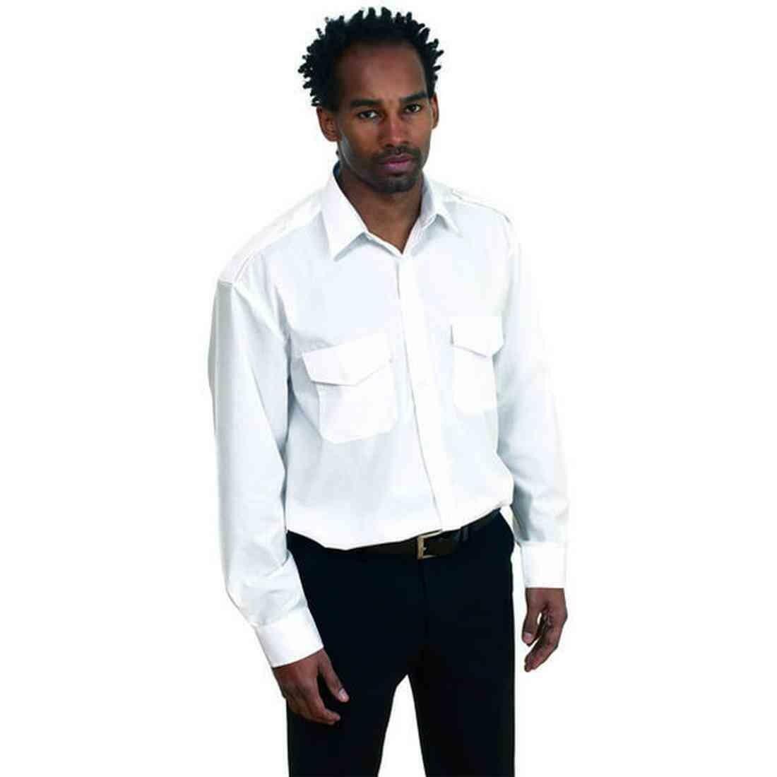 A man in a white button-up shirt and black pants, standing with a serious expression wearing Uneek's UC707.