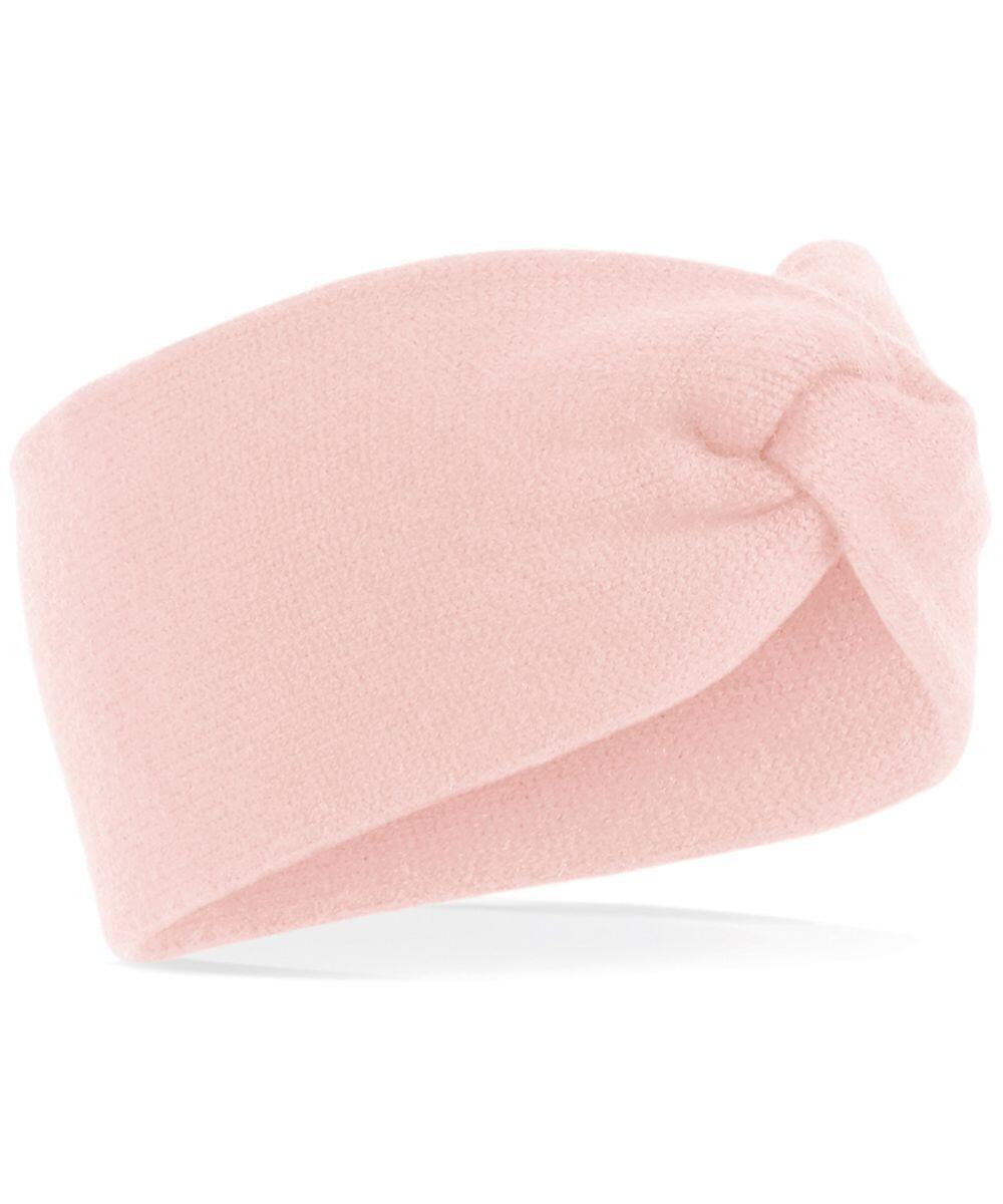 The Beechfield BC432 is a headband crafted from soft pink fabric and features a twisted knot design at the front.