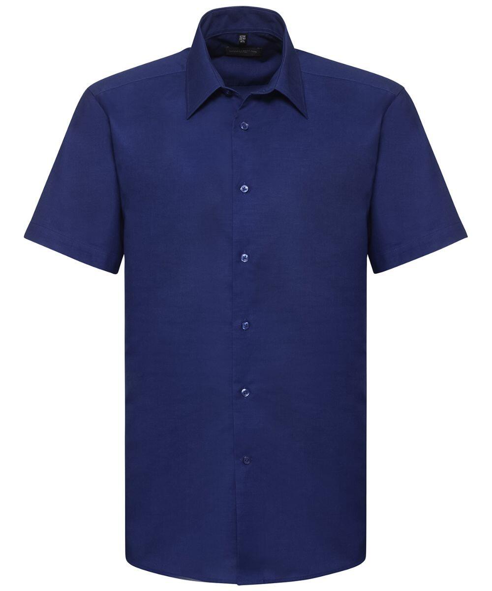 A plain short-sleeve button-up shirt in navy blue from the Russell Collection, model J923M.