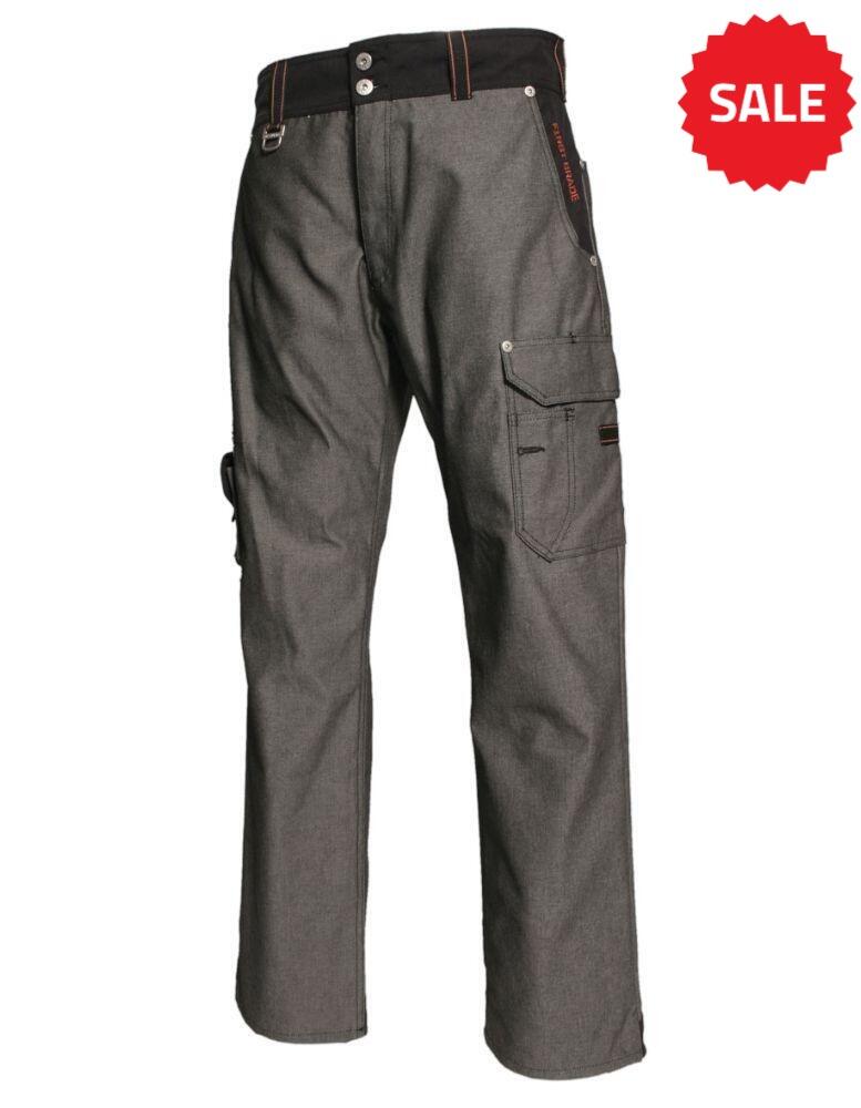 A pair of grey Tranemo TR2160_27 work pants made of durable fabric with multiple pockets and reinforced seams. The pants feature a black waistband with button closure, belt loops, and an additional side pocket with orange stitching details.