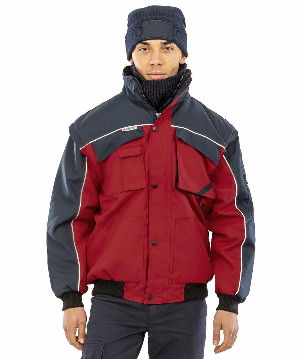 Person wearing a red and dark blue jacket with reflective trimming from Result, the RE71A, a navy blue beanie, and a black neck warmer, standing against a plain white background.