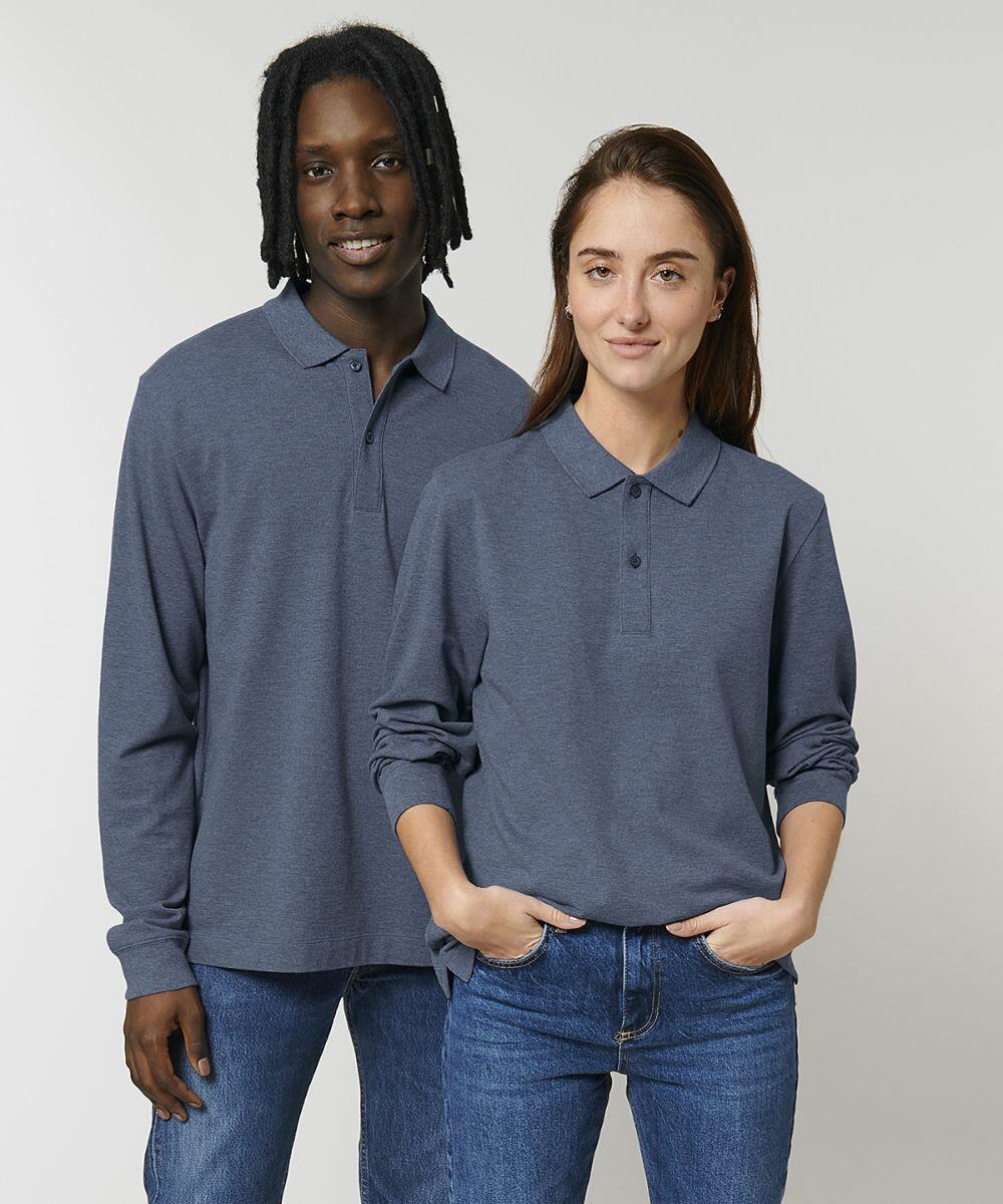 Two people wearing Stanley/Stella SX127 blue long-sleeve shirts and jeans stand side by side against a plain background, one with hands in pockets.