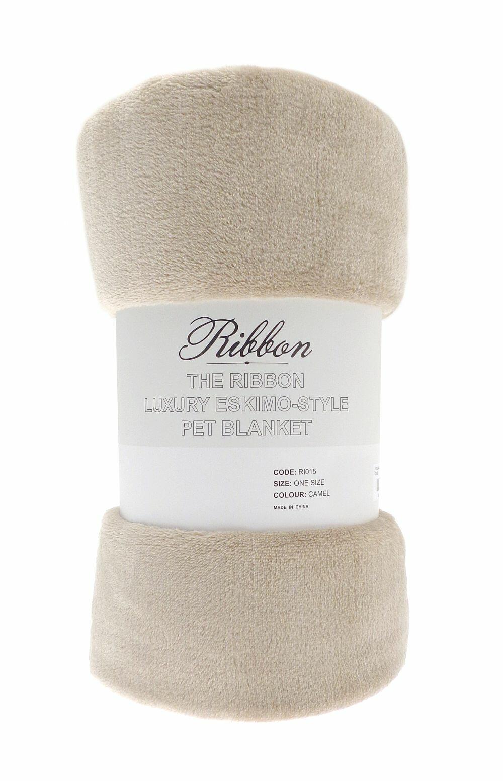 A luxurious Eskimo-style pet blanket from Ribbon, rolled up in a camel color and featuring a label with product information for RI015.