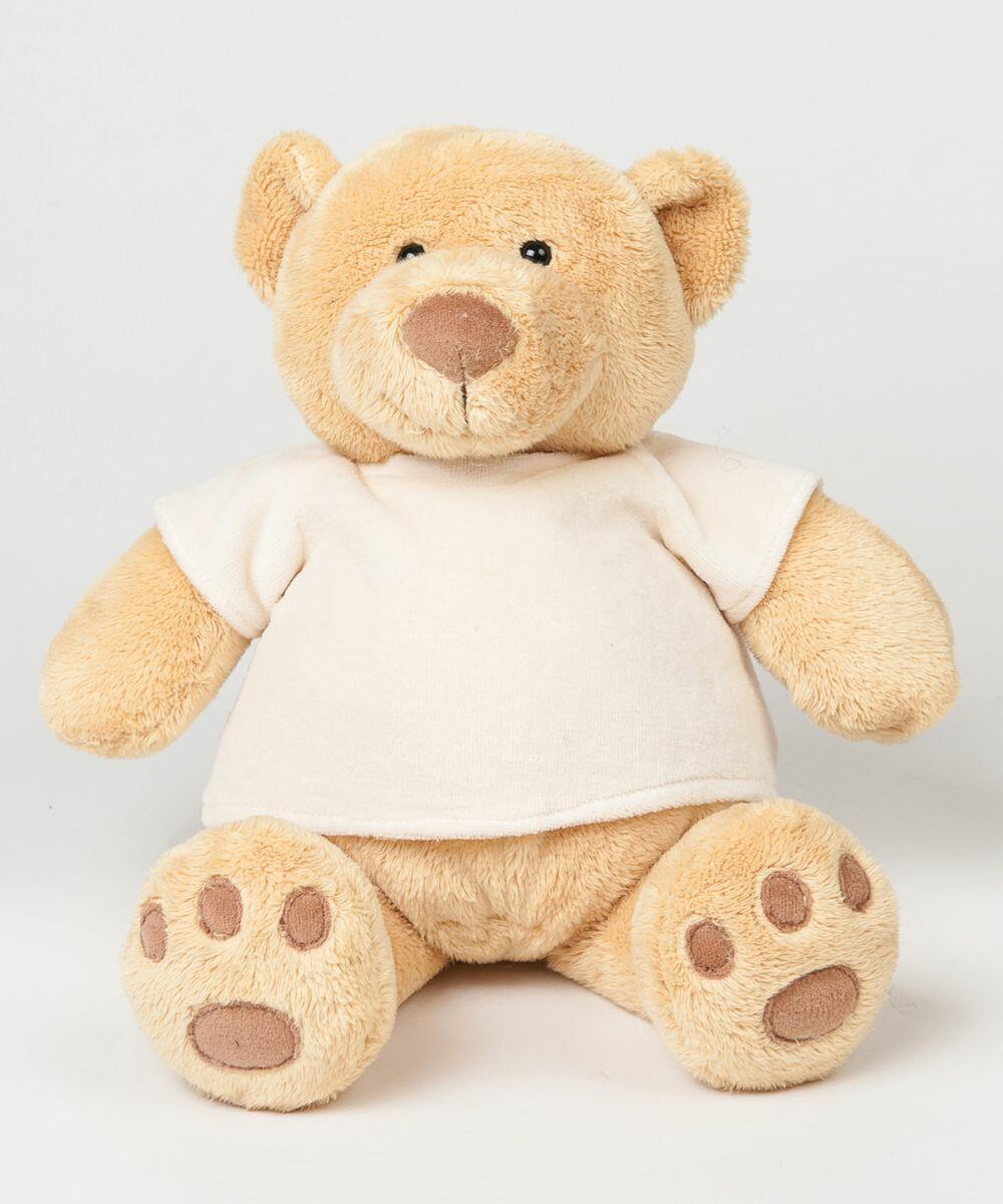 A plush teddy bear with light brown fur, wearing a plain white T-shirt, sits against a neutral background. It is the MM021 from Mumbles.