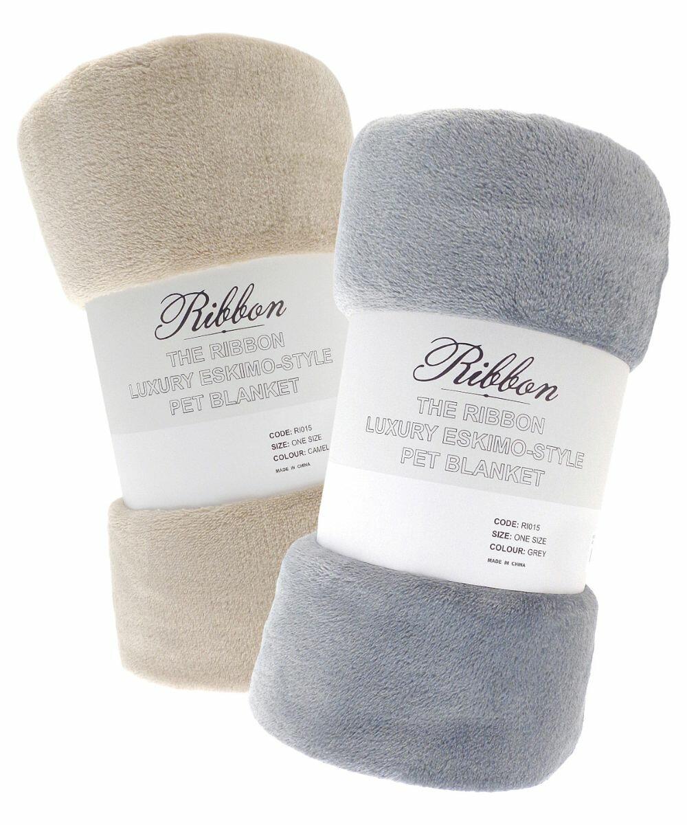 Two rolled luxury Eskimo-style pet blankets by "Ribbon," one in beige and one in grey, are displayed side by side, each with a labeled band around them with the product name RI015.