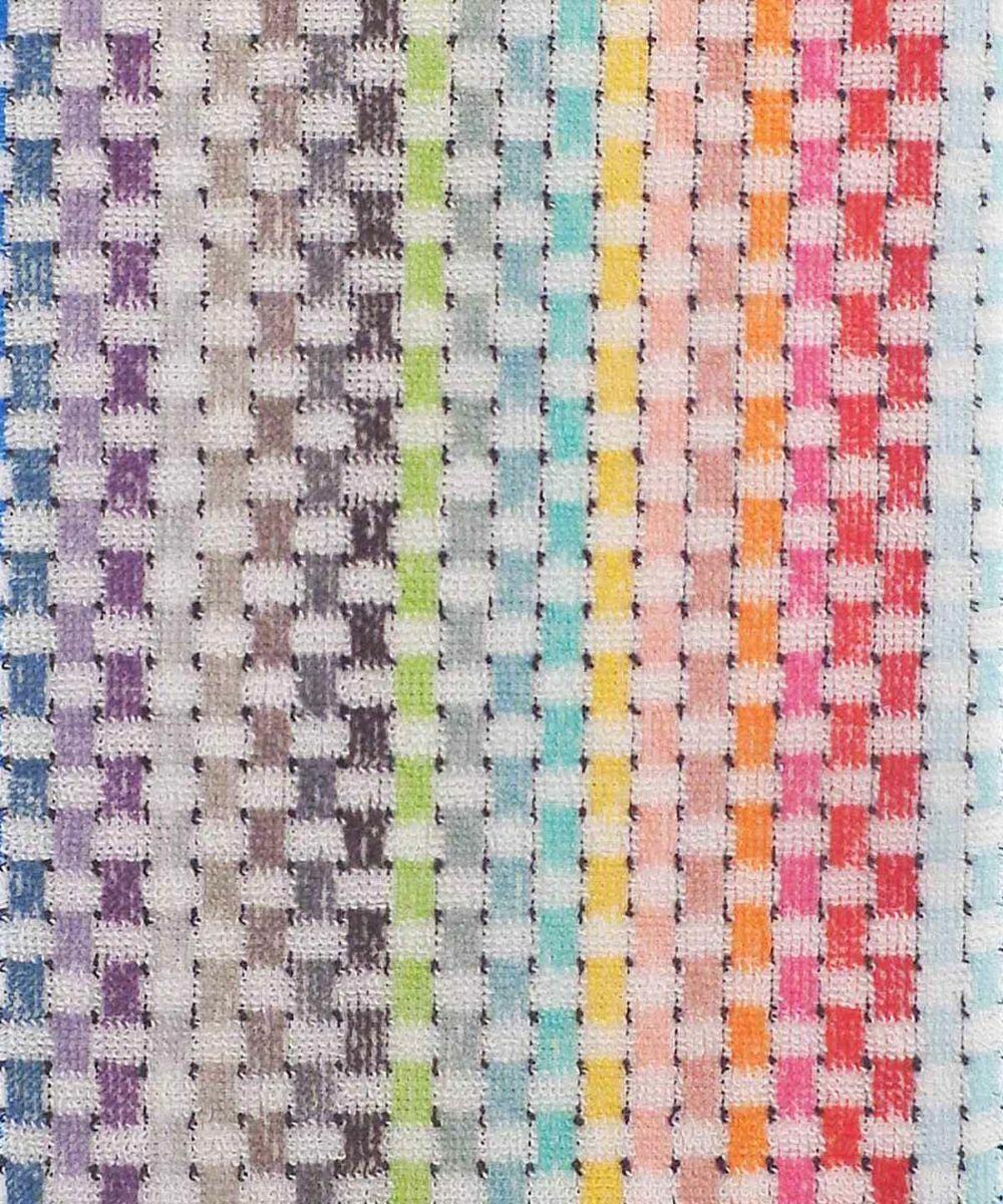 A close-up image of the Home & Living HL212 textile showcases a checkered pattern featuring a vibrant combination of colors including blue, green, purple, pink, orange, and red arranged in vertical stripes.