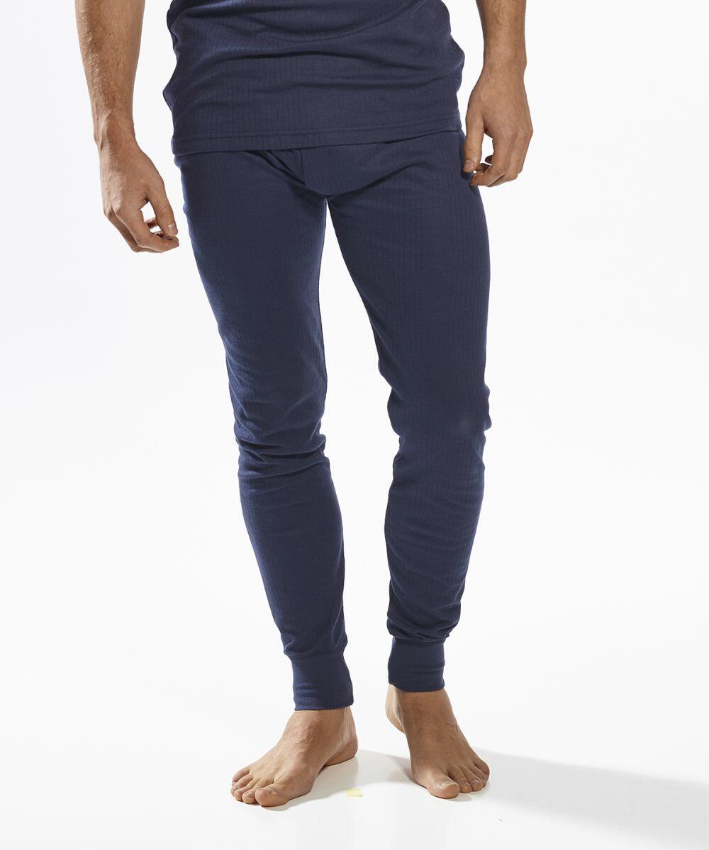 A person wearing navy blue Portwest PW142 thermal underwear stands barefoot against a white background. The image focuses on the lower body, showing the thermal pants.