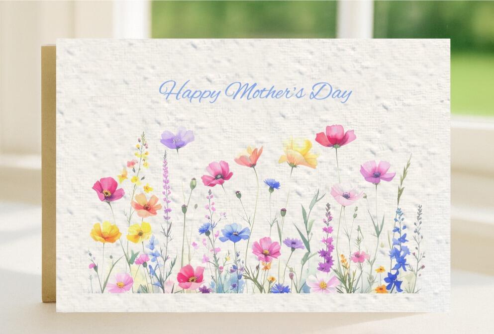Wildflower seeded plantable Mother's Day card, with happy Mother's Day printed across the top and the card is filled with a bright and colourful dsiplay of wildflowers