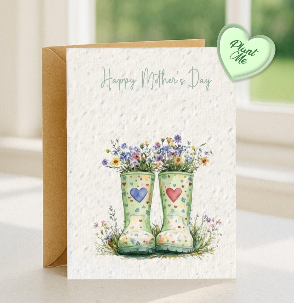 A Plantable car with two green wellies endourned with a blue and red love hearts, there are wildflowers growing out of the top