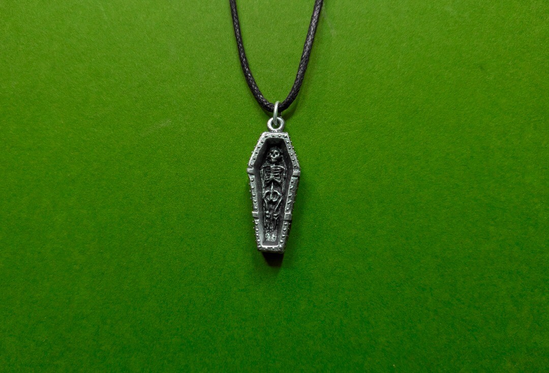 Void Clothing | Open Coffin & Skeleton Pewter Pendant - Front
