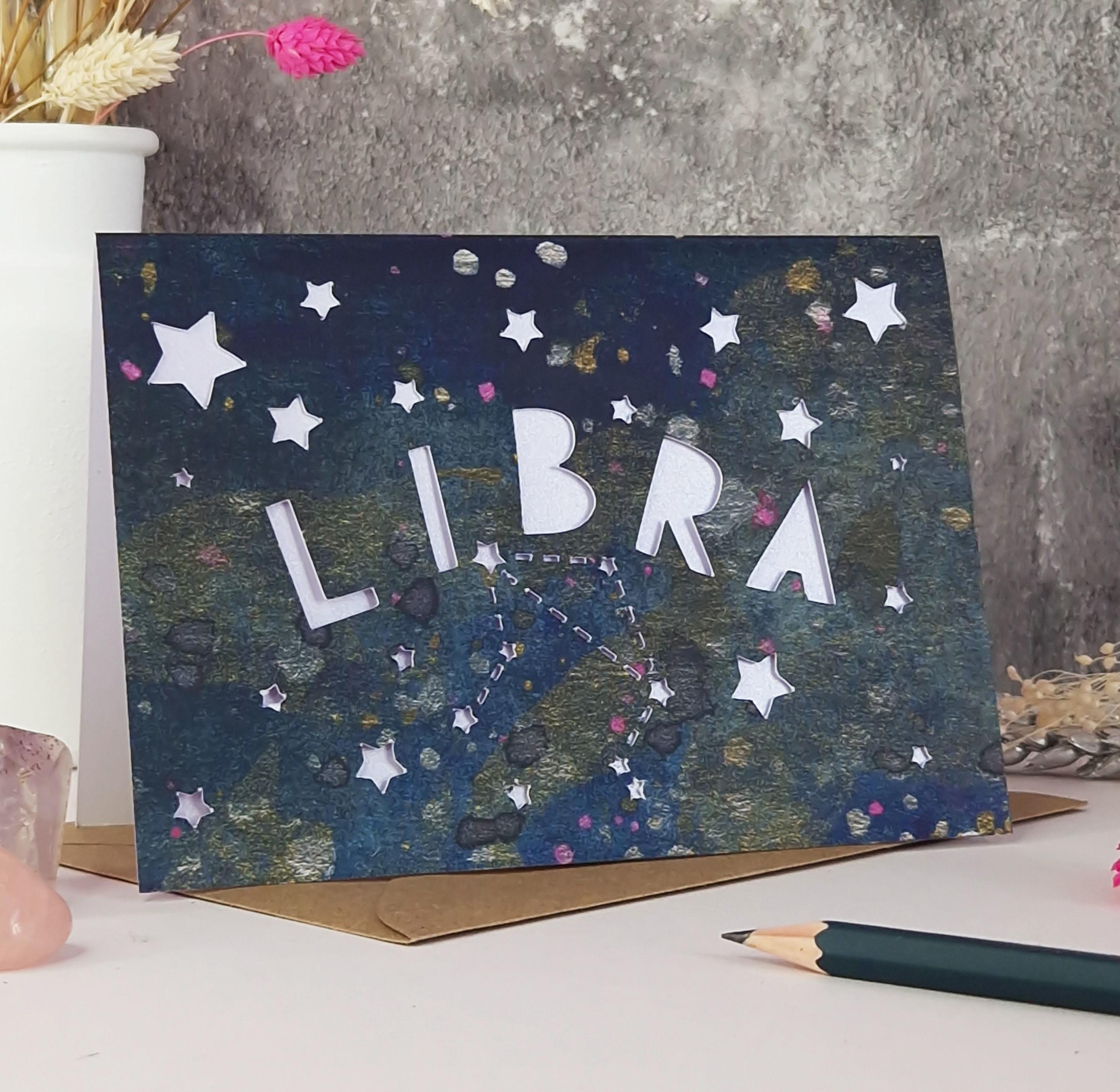 Midnight Blue printed card with papercut text that says 'Libra' and a lilac pearl liner