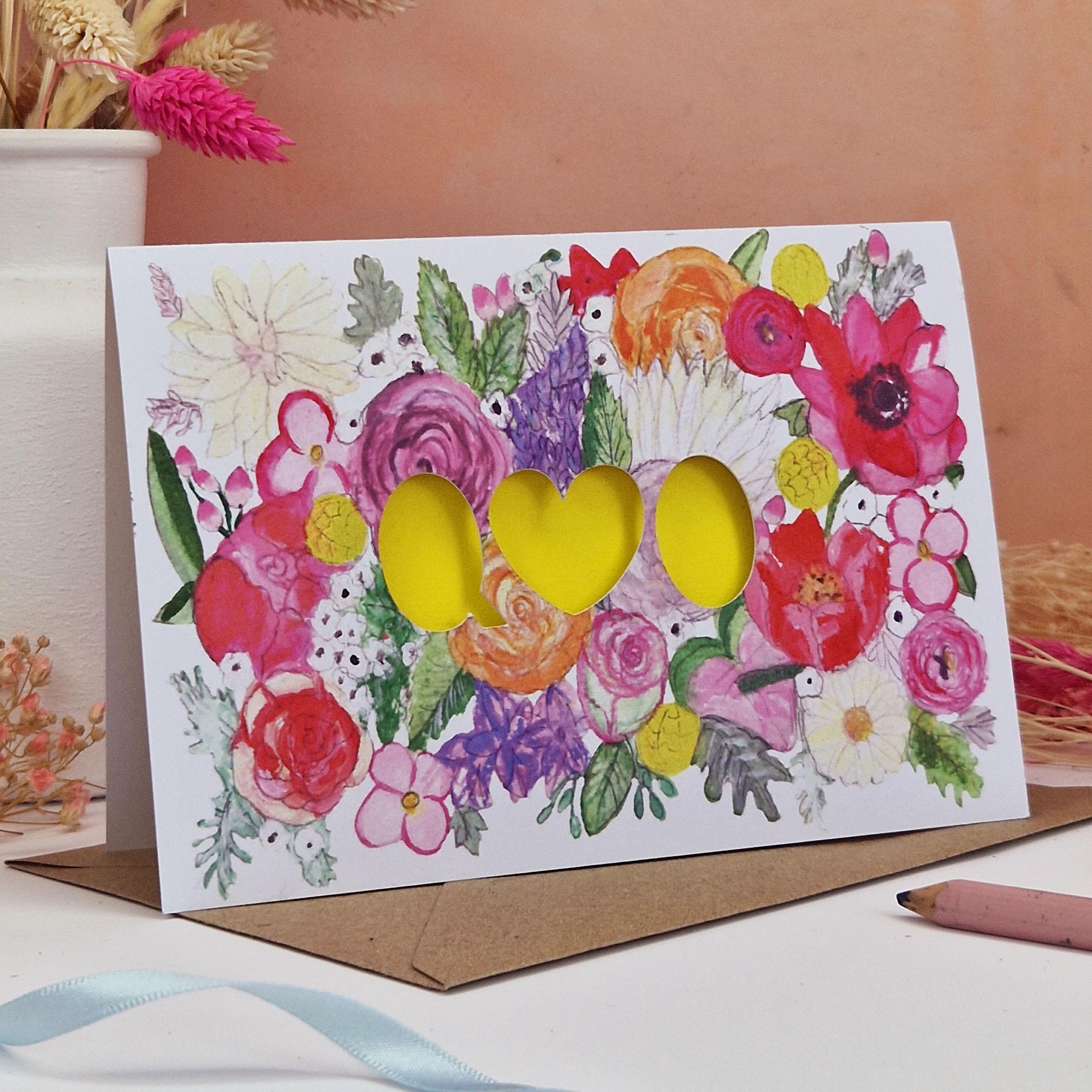 Floral Card with Paper cut text that is personalised with Initials with bright floral background and orange paper liner inside.