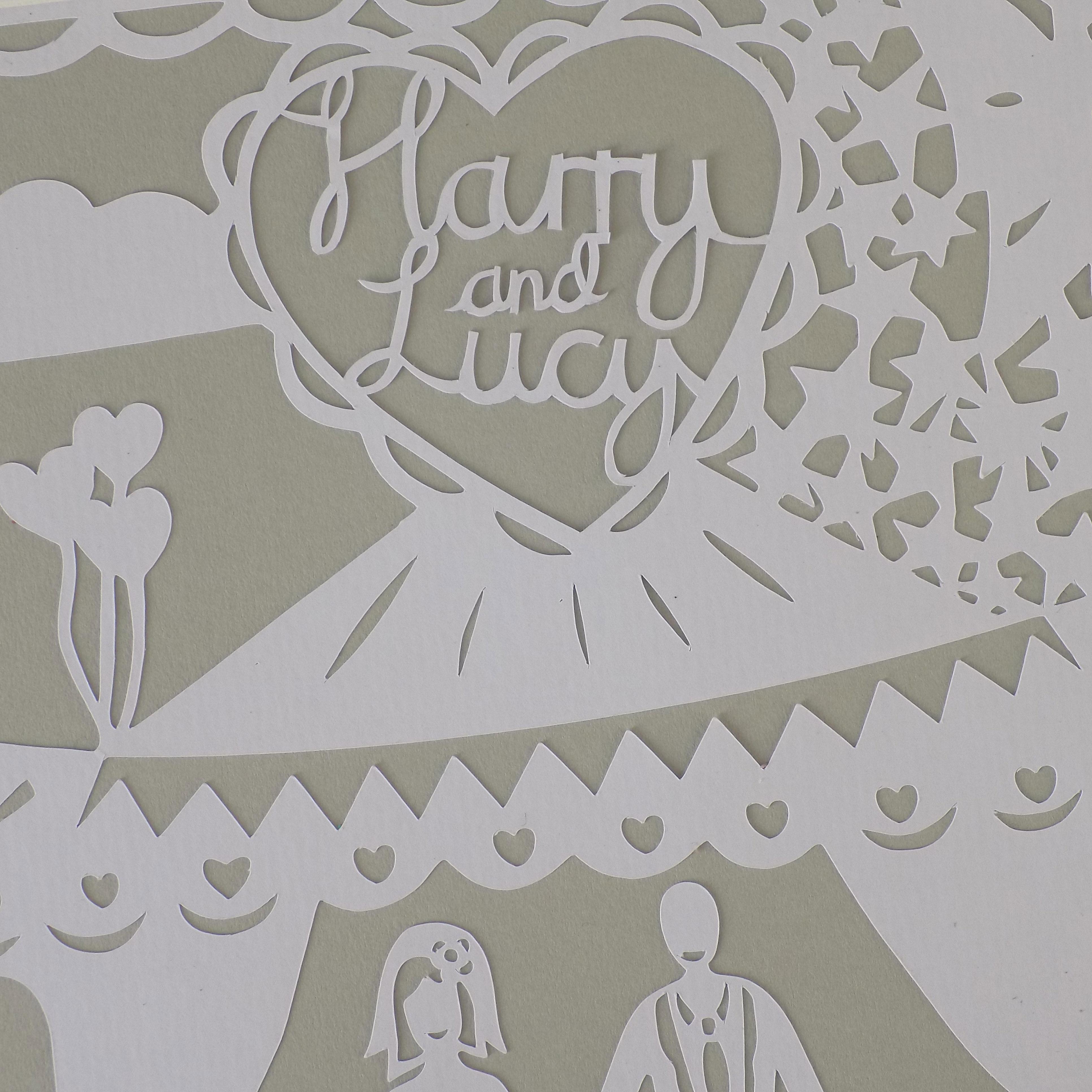 A close up of a church theme wedding paper cut.