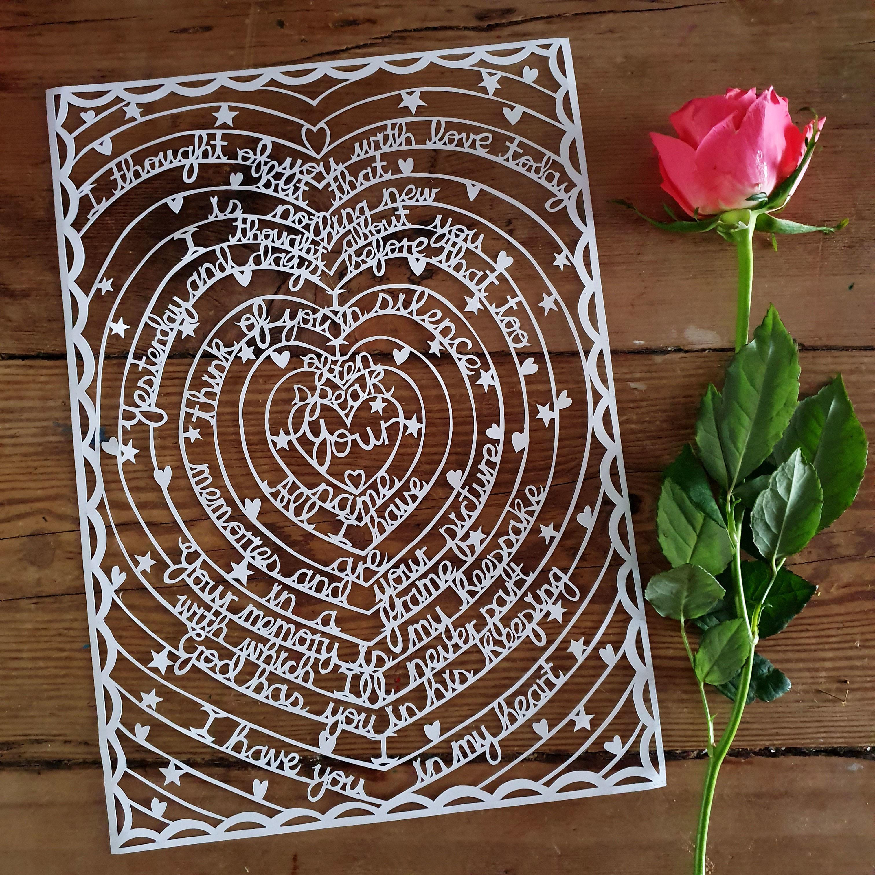 hand cut, hand drawn paper cut of song lyrics or wedding reading