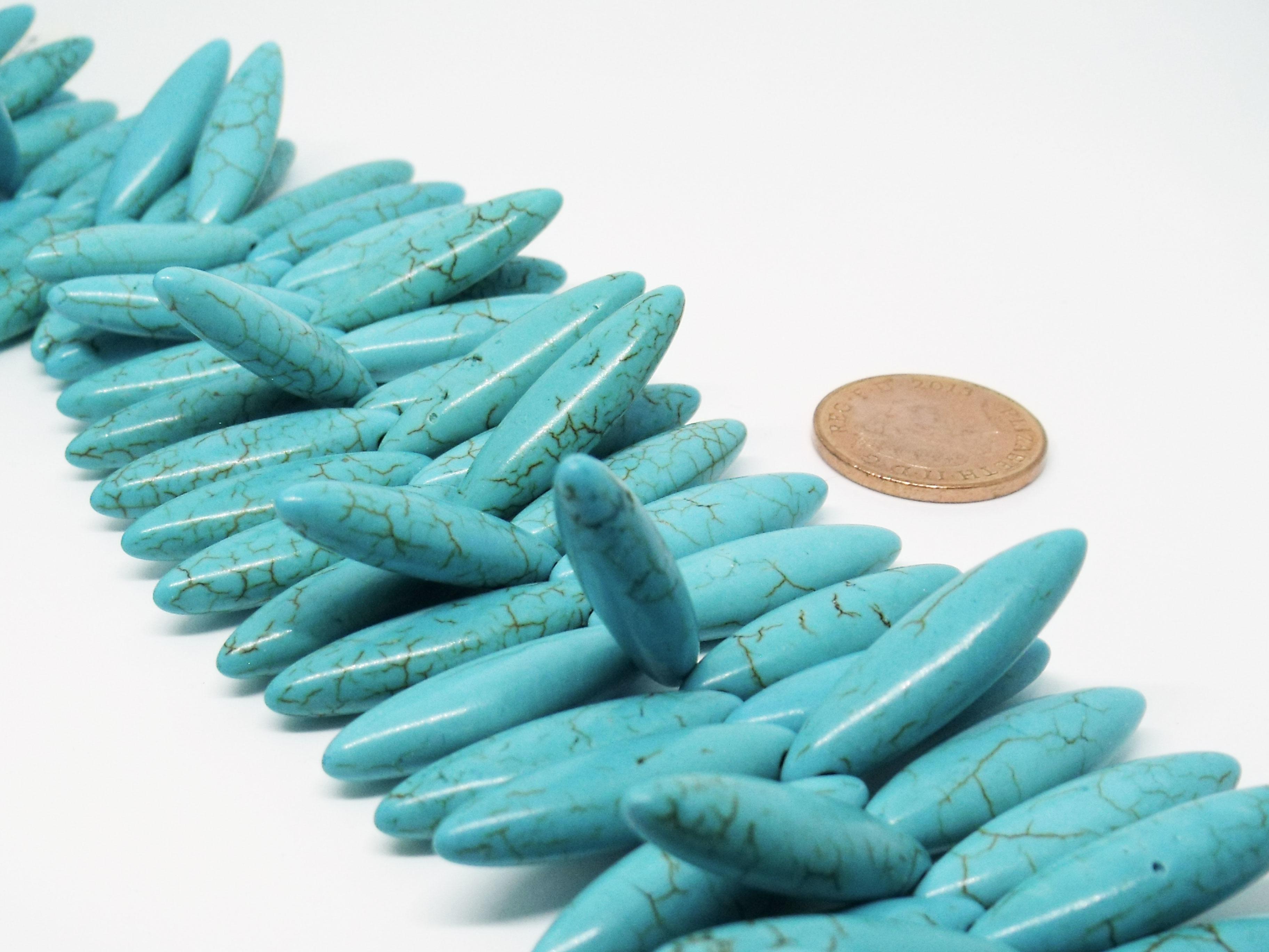 28x7mm Top Drilled Rice Bead - Synthetic Turquoise
