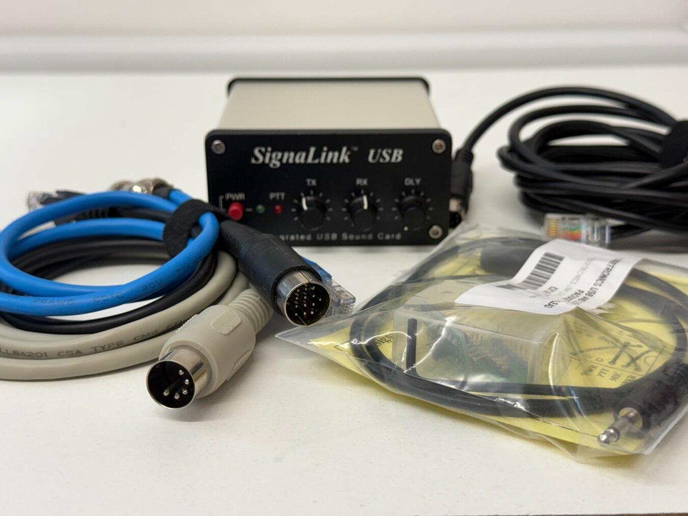 Used SignaLink USB sound card interface with various radio cables