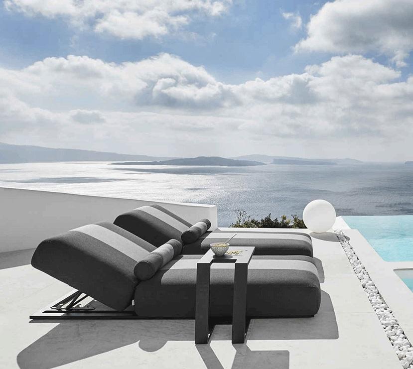 sun lounger daybeds in grey by pool