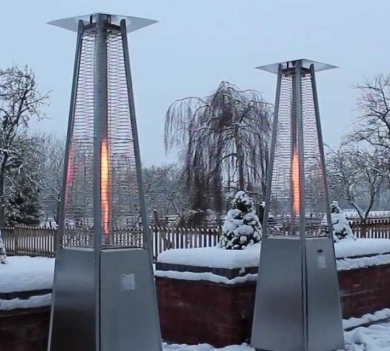 2 steel contemporary gas patio heaters in snow
