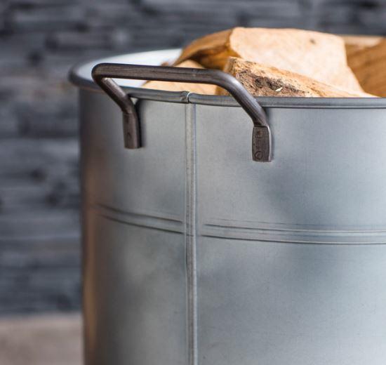 modern log bucket or wood store for indoor use by fireplace in galvanised steel