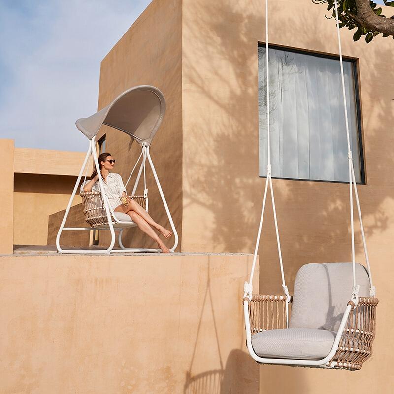 single garden swing seat modern hanging chair in white aluminium with natural rattan wicker and sun canopy and all weather cushions moon