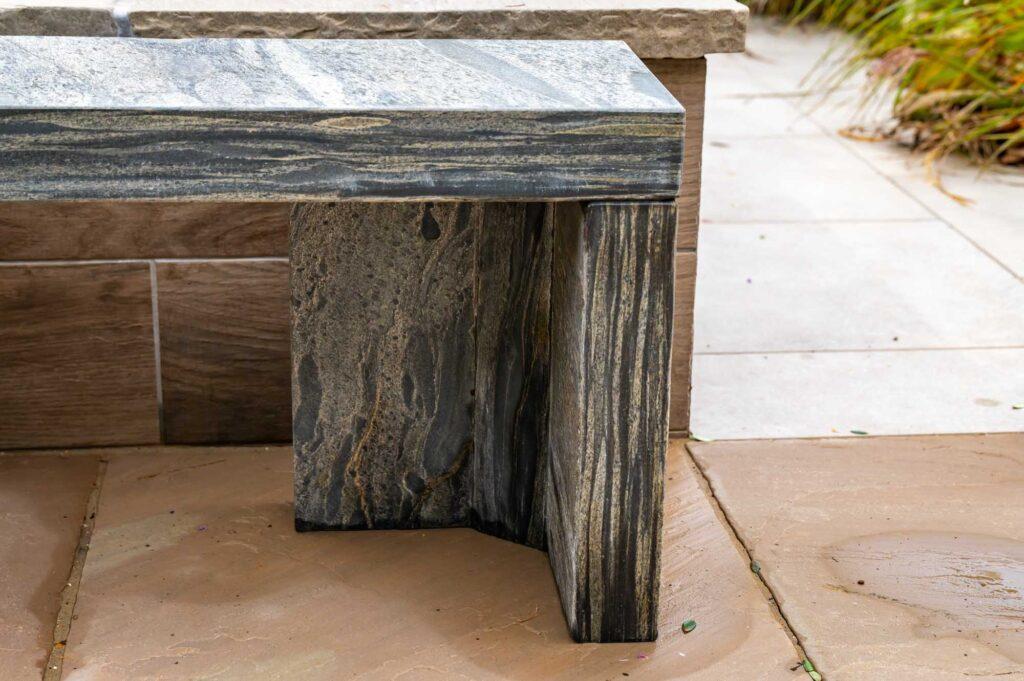 sandstone bench in grey pewter cubist design leg detail