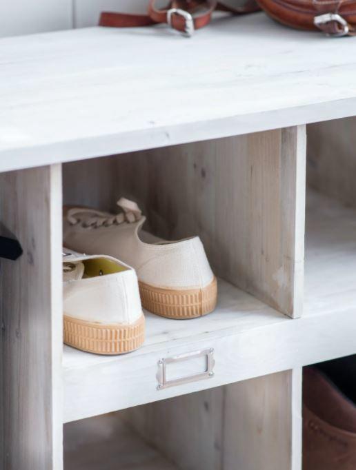 low welly storage unit in a white wood