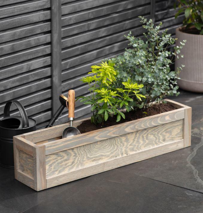 spruce wood window box or garden trough planters