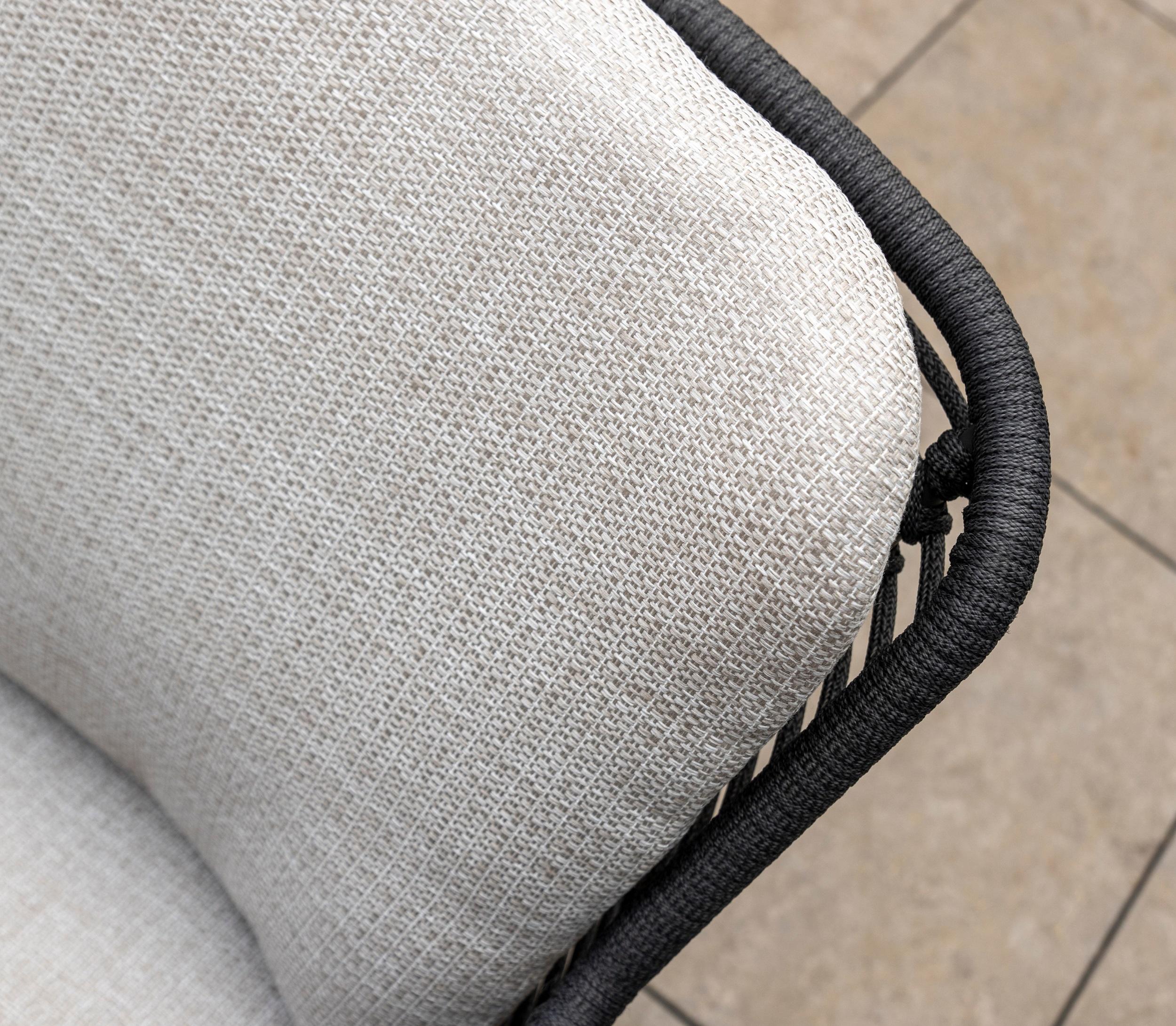light grey weather resistant cushions on modern rope weave all weather garden dining chairs