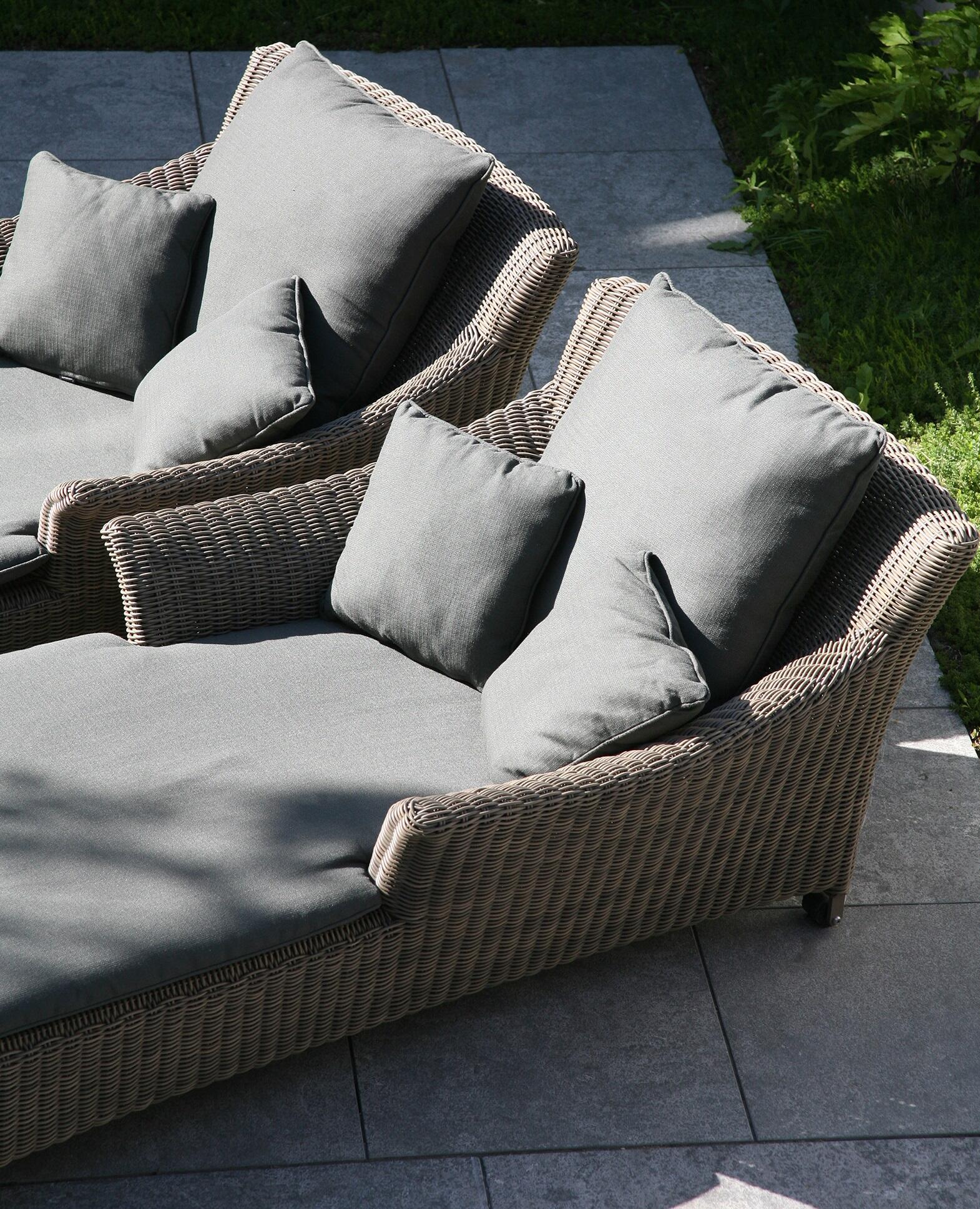 weatherproof wicker rattan single garden daybed or sun lounger with grey cushioons