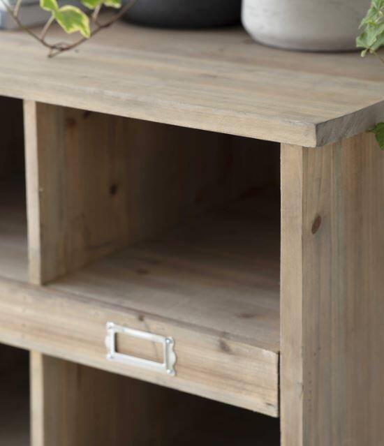 detail of natural wood cubby hole for indoor shoe locker