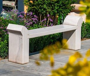 cream natural sandstone garden bench with curved arms