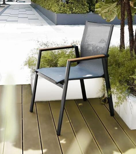 modern grey sling and metal stacking garden dining chairs with teak armrests aspen