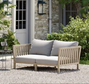 modern garden daybed in acacia hardwood, slatted wood with grey cushions porthallow