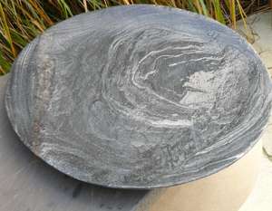 grey slate bird bowl in garden