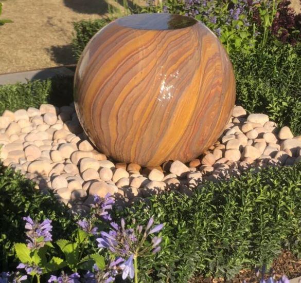 garden water feature or fountain in natural rainbow sandstone