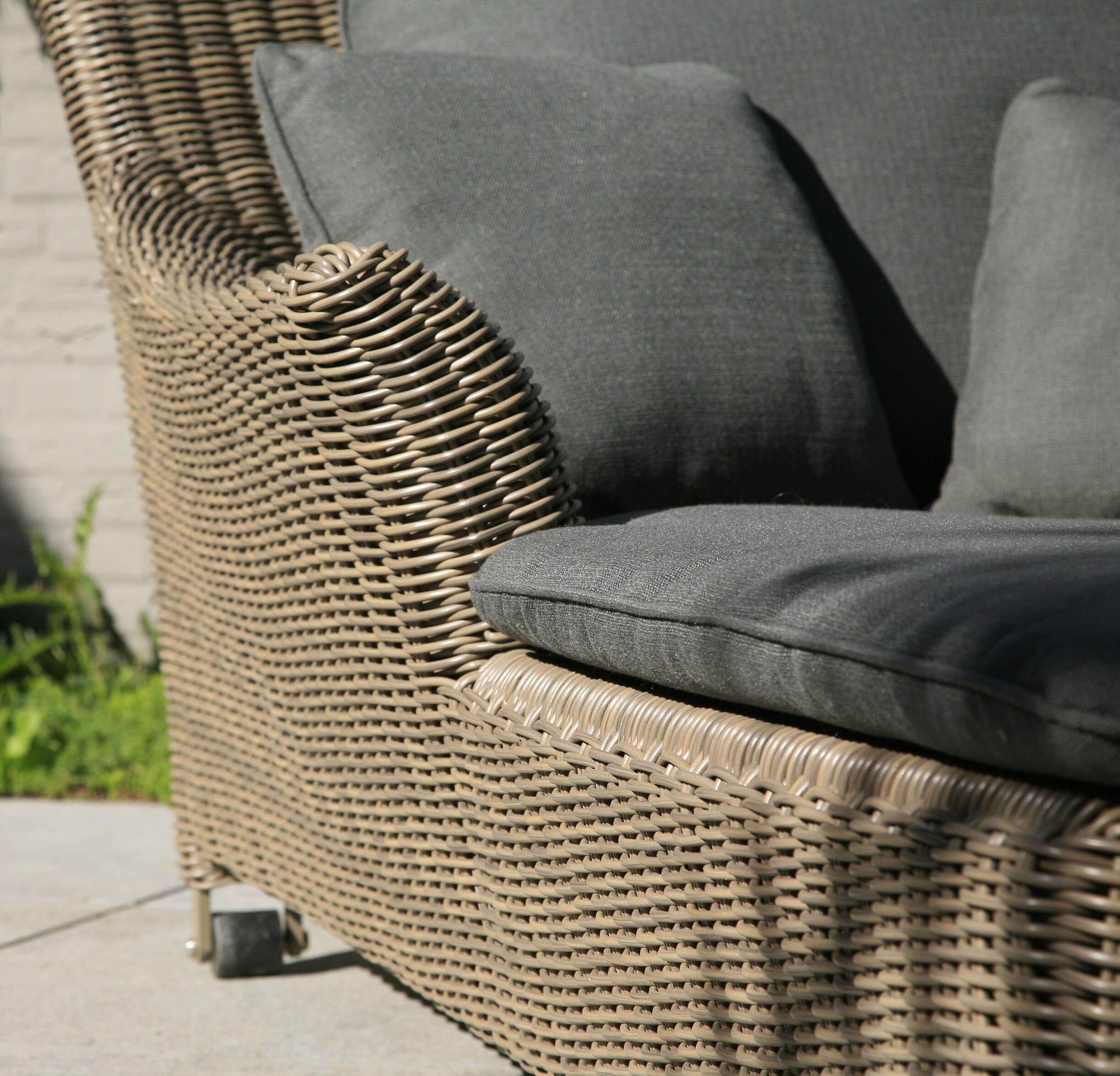 detail of stone all weather rattan weave garden poolside daybed double sun lounger with grey cushions