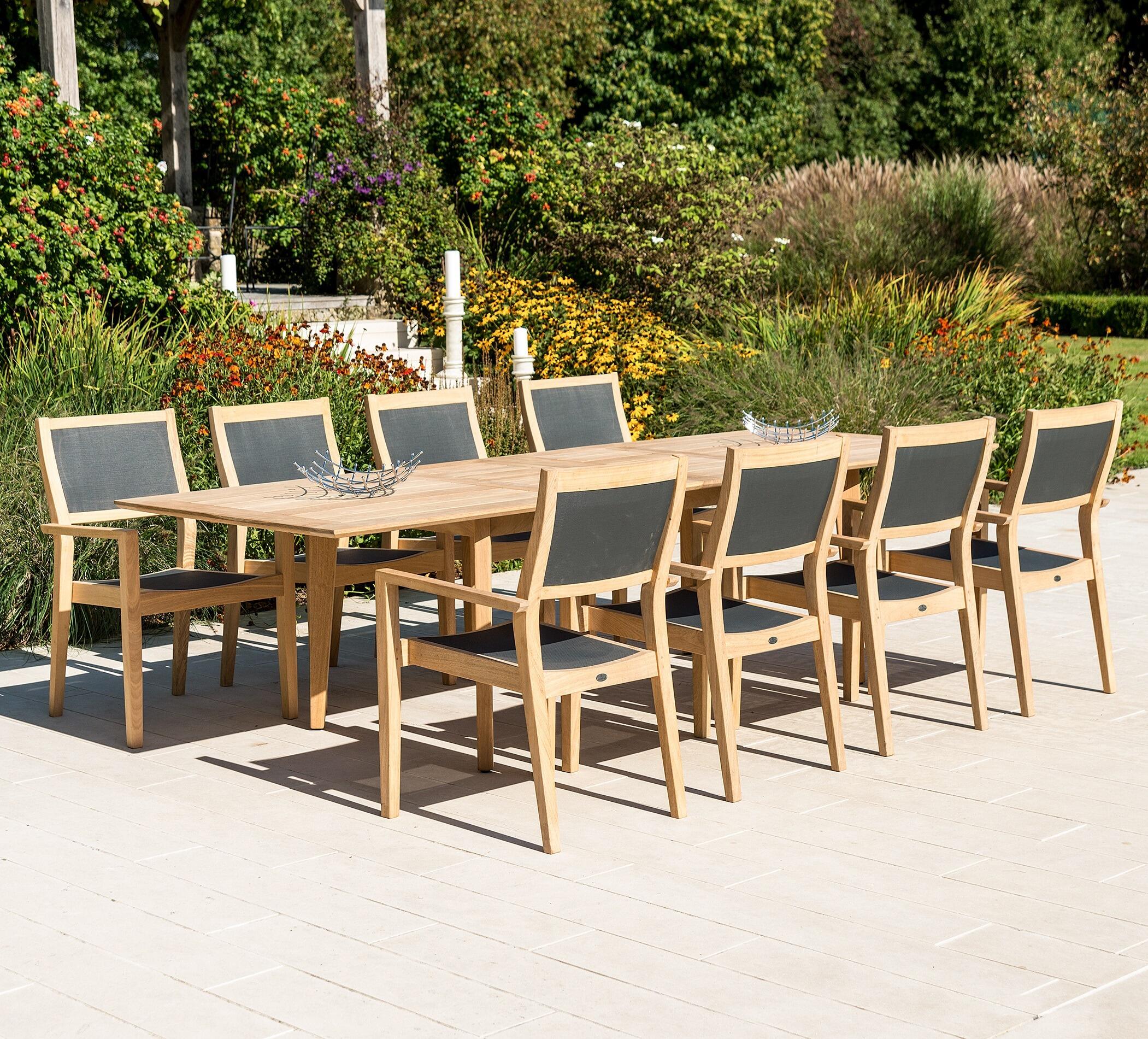 modern extending garden dining table 10 seater with roble hardwood and black rose dining chairs armchairs