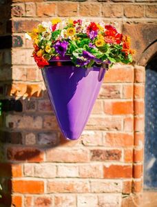 wall mounted fibreglass cone planter in lilac modern garden