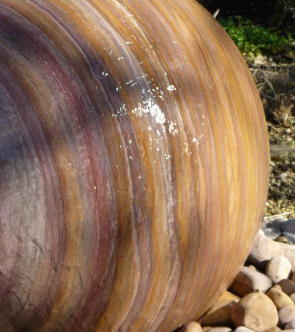 rainbow sandstone hues in detail of the water ball sphere