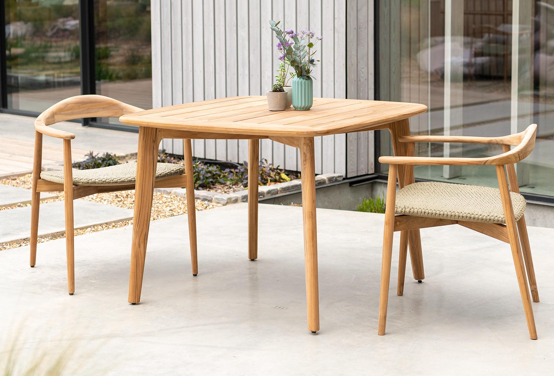 square compact teak garden dining table shown with 2 chairs