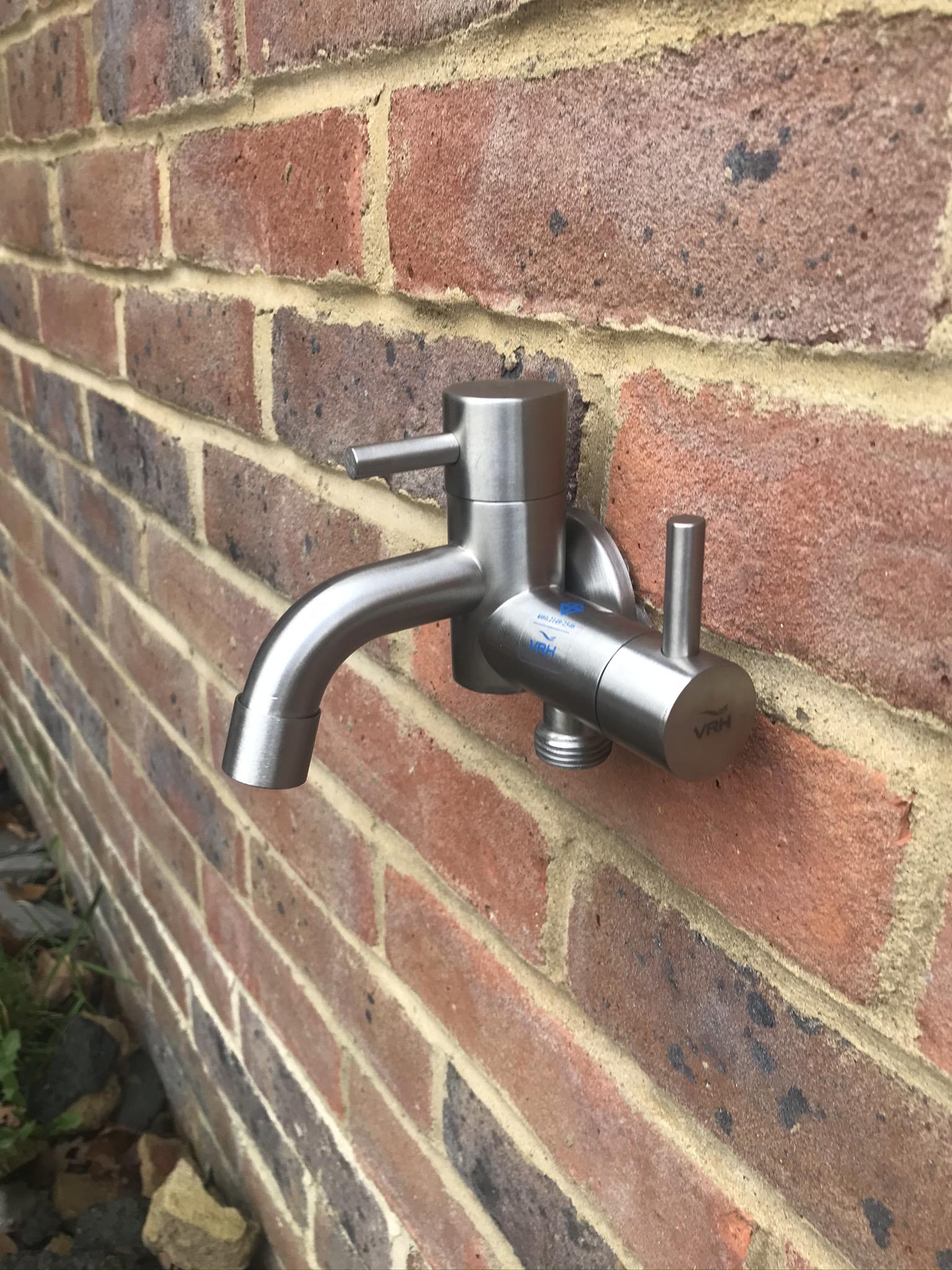 modern outside garden wall tap in 304 outdoor grade brushed stainless steel on brick wall