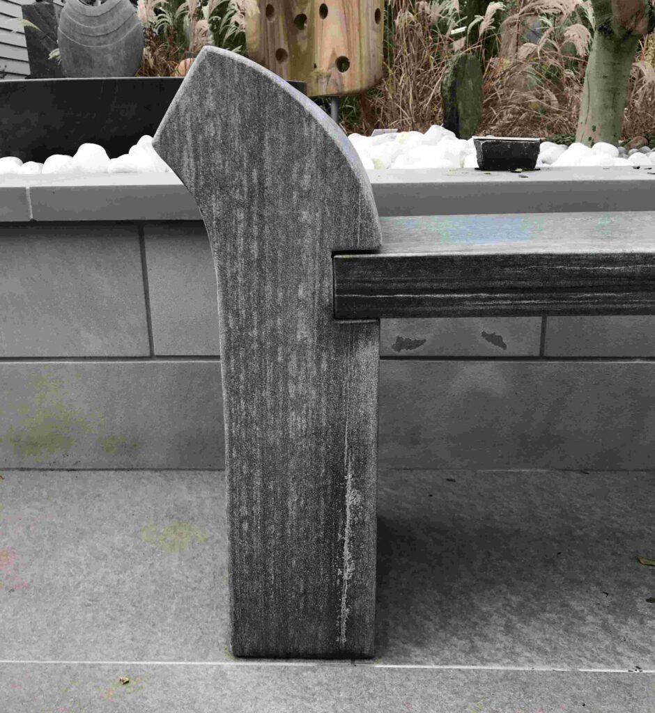 detail of ebony grey sandstone garden bench
