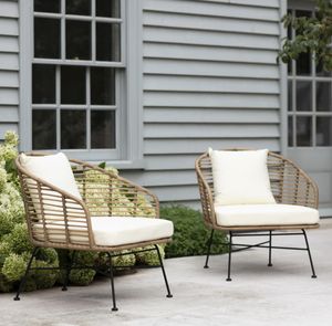 rattan bamboo weave garden lounge armchairs for outdoor and indoor use with cream cushions