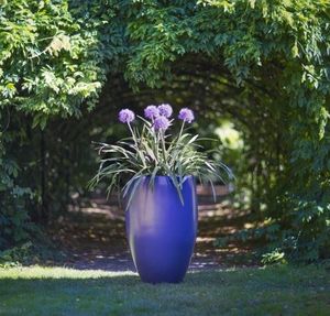 blue curvy outdoor garden planter in high quality fibreglass