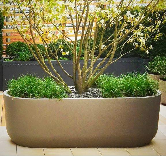 fibreglass planter for gardens and outdoor spaces modern contemporary huge curved trough planter