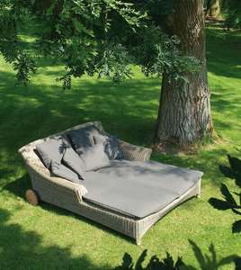 rattan garden or pool sun lounger or outdoor day bed