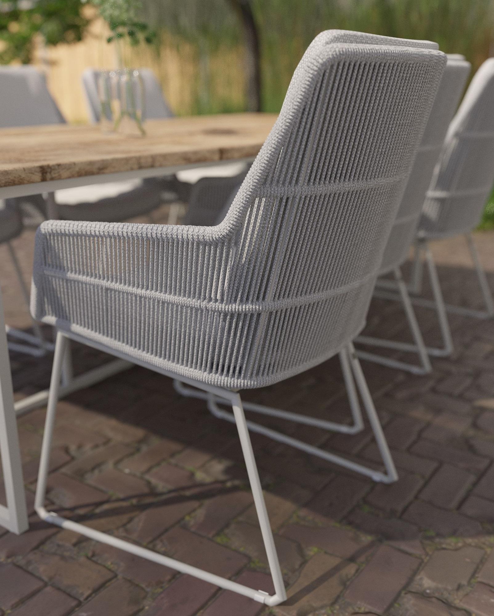 weatherproof rope weave garden dining chairs with white aluminium frames and teak garden dining table