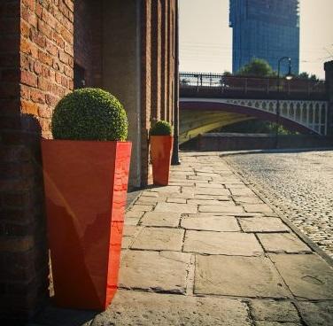 tall tapered orange fibreglass garden planter or pot for indoor or outdoor use