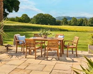 6 seater garden dining set table and stacking chairs wooden acacia hardwood cotswolds national trust