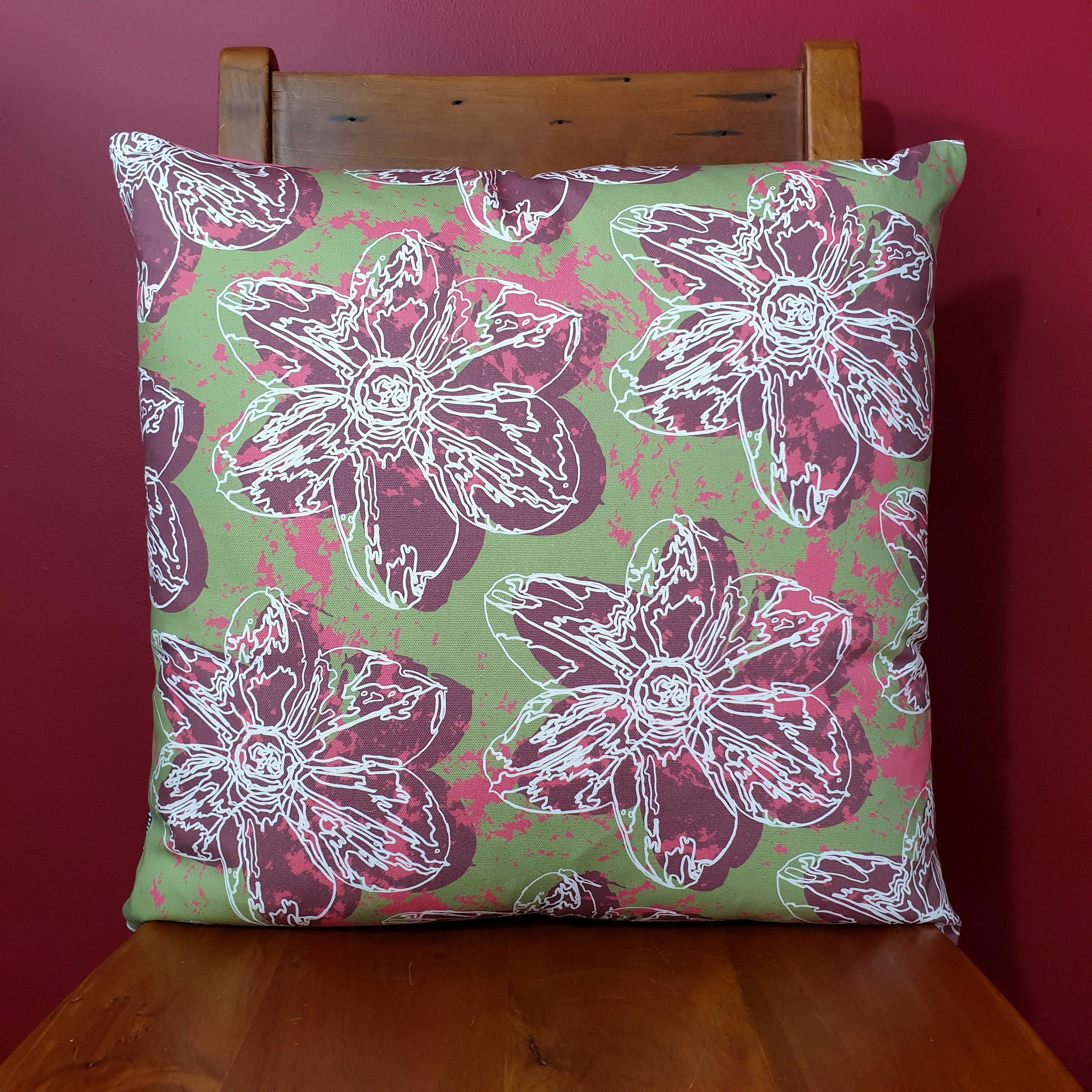 Double-sided 51cm square Flower Splash cushion designed by thetinkan. Dark red narcissus flower with white traced outline set within an olive green background with salmon pink paint splashes. Available with an optional luxury cushion inner pad. VIEW PRODUCT >>